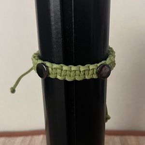 Handcrafted Braided Bracelet with Two Button-like Charms